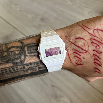 Custom Casio F-91W White digital watch featuring a Purple drink filter screen. Slim 8.5 mm profile, lightweight 21 g build and flexible bio-based resin band ensure lasting comfort. Includes alarm, stopwatch, and microlight function for everyday functionality.