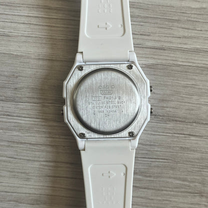 Custom Casio F-91W White digital watch featuring a Purple drink filter screen. Slim 8.5 mm profile, lightweight 21 g build and flexible bio-based resin band ensure lasting comfort. Includes alarm, stopwatch, and microlight function for everyday functionality.