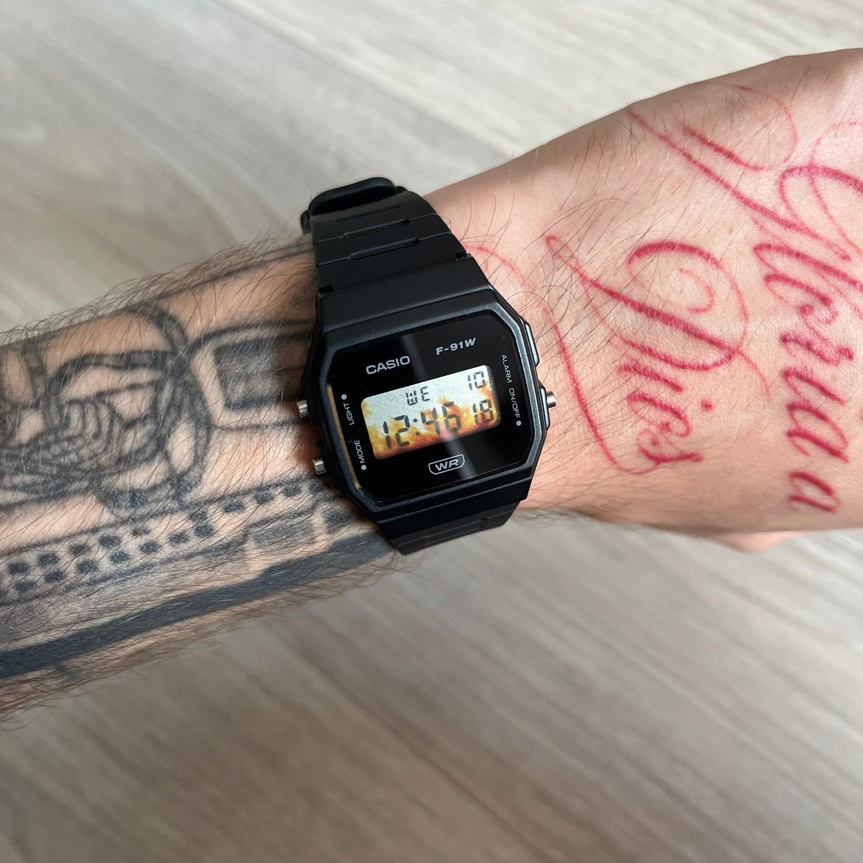 Custom Casio F-91W Black digital watch featuring a Flame filter screen. Slim 8.5 mm profile, lightweight 21 g build and flexible bio-based resin band ensure lasting comfort. Includes alarm, stopwatch, and microlight function for everyday functionality.