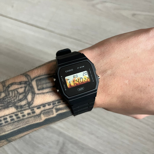 Custom Casio F-91W Black digital watch featuring a Flame filter screen. Slim 8.5 mm profile, lightweight 21 g build and flexible bio-based resin band ensure lasting comfort. Includes alarm, stopwatch, and microlight function for everyday functionality.