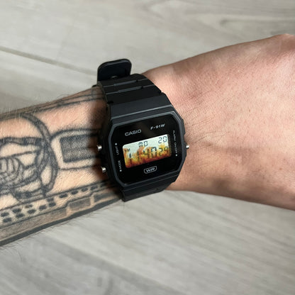 Custom Casio F-91W Black digital watch featuring a Flame filter screen. Slim 8.5 mm profile, lightweight 21 g build and flexible bio-based resin band ensure lasting comfort. Includes alarm, stopwatch, and microlight function for everyday functionality.