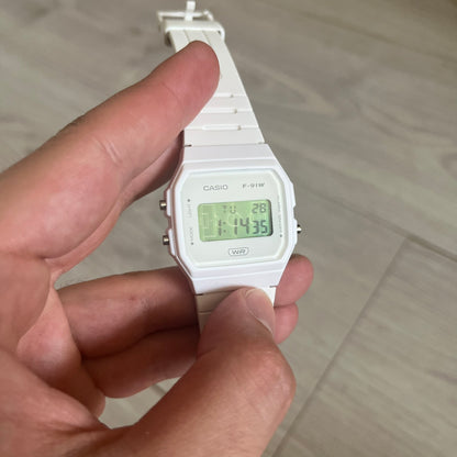 Custom Casio F-91W White digital watch featuring a Green Football Pitch filter screen. Slim 8.5 mm profile, lightweight 21 g build and flexible bio-based resin band ensure lasting comfort. Includes alarm, stopwatch, and microlight function for everyday functionality.