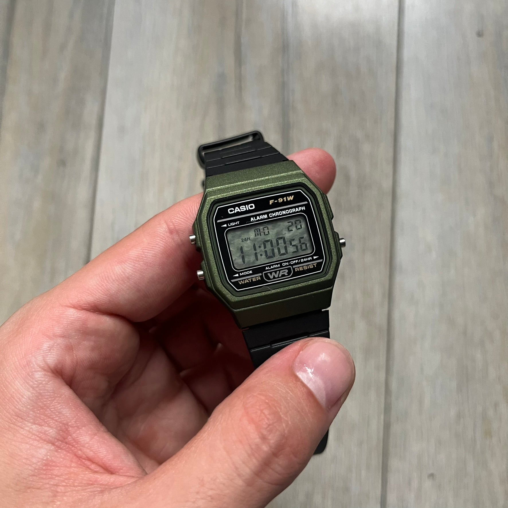 Custom Casio F-91W Military Green digital watch featuring a Camo filter screen. Slim 8.5 mm profile, lightweight 21 g build and flexible bio-based resin band ensure lasting comfort. Includes alarm, stopwatch, and microlight function for everyday functionality.