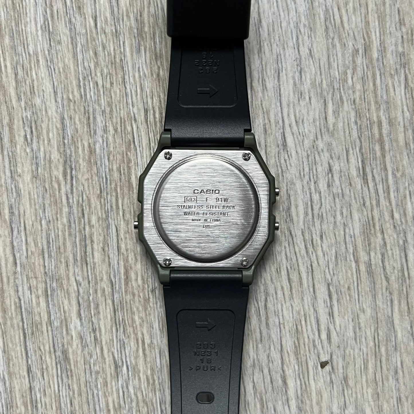 Custom Casio F-91W Military Green digital watch featuring a Camo filter screen. Slim 8.5 mm profile, lightweight 21 g build and flexible bio-based resin band ensure lasting comfort. Includes alarm, stopwatch, and microlight function for everyday functionality.