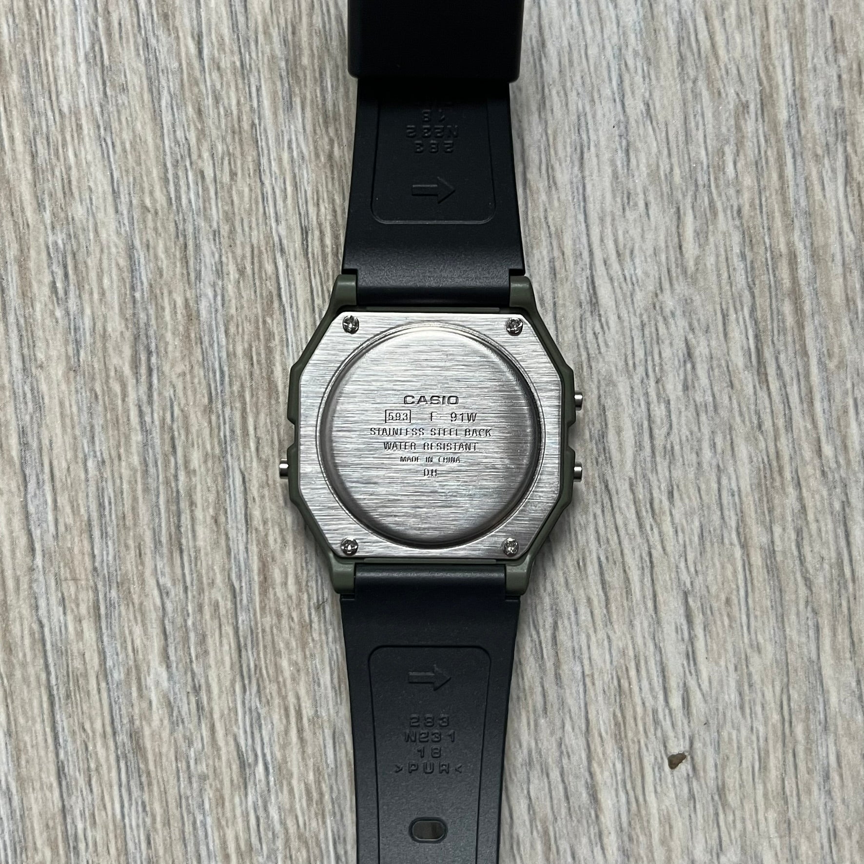 Custom Casio F-91W Military Green digital watch featuring a Camo filter screen. Slim 8.5 mm profile, lightweight 21 g build and flexible bio-based resin band ensure lasting comfort. Includes alarm, stopwatch, and microlight function for everyday functionality.