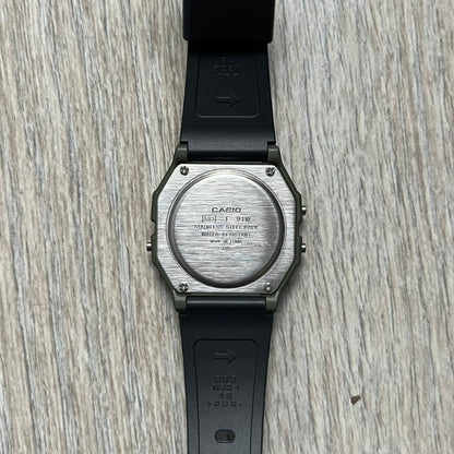 Custom Casio F-91W Military Green digital watch featuring a Camo filter screen. Slim 8.5 mm profile, lightweight 21 g build and flexible bio-based resin band ensure lasting comfort. Includes alarm, stopwatch, and microlight function for everyday functionality.