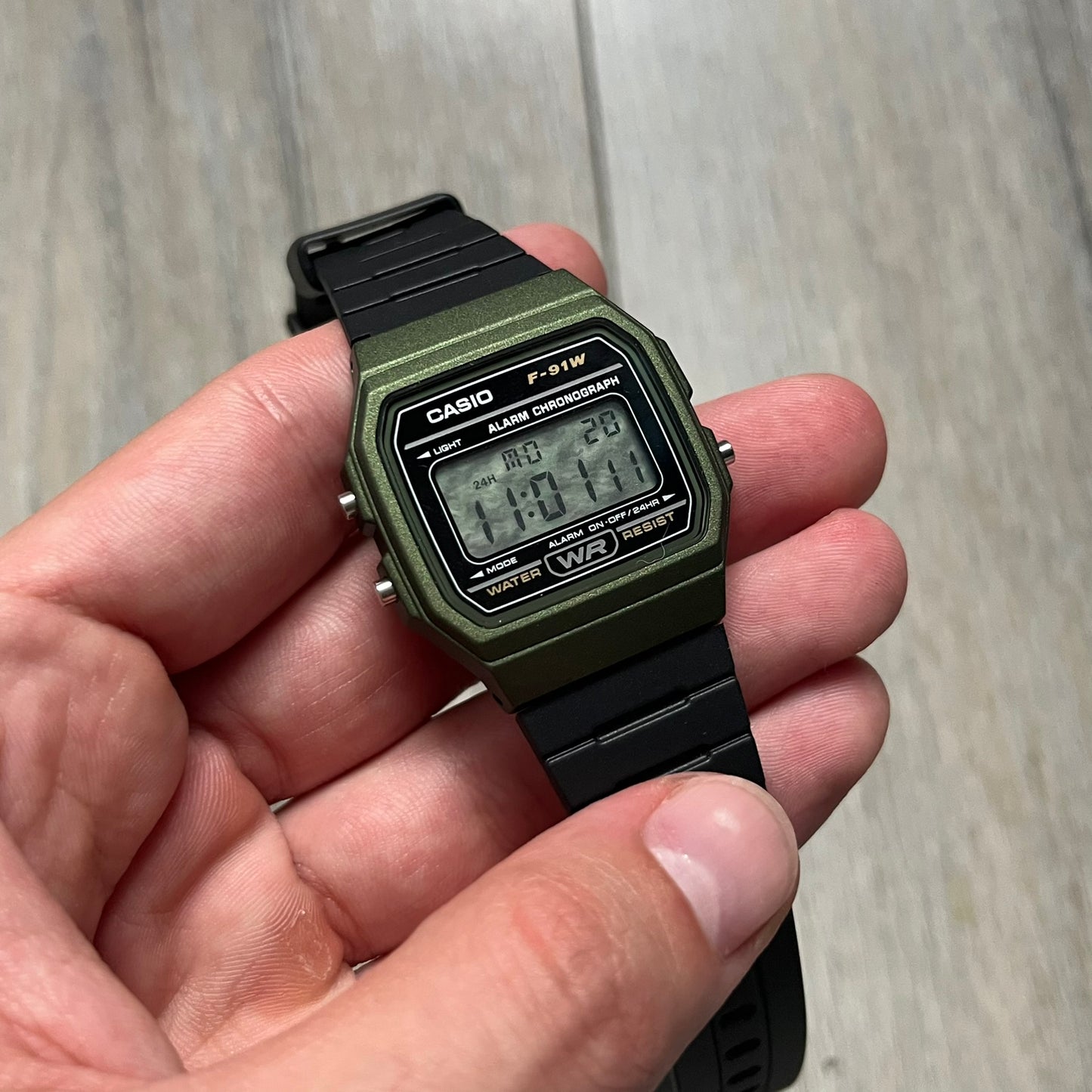 Custom Casio F-91W Military Green digital watch featuring a Camo filter screen. Slim 8.5 mm profile, lightweight 21 g build and flexible bio-based resin band ensure lasting comfort. Includes alarm, stopwatch, and microlight function for everyday functionality.