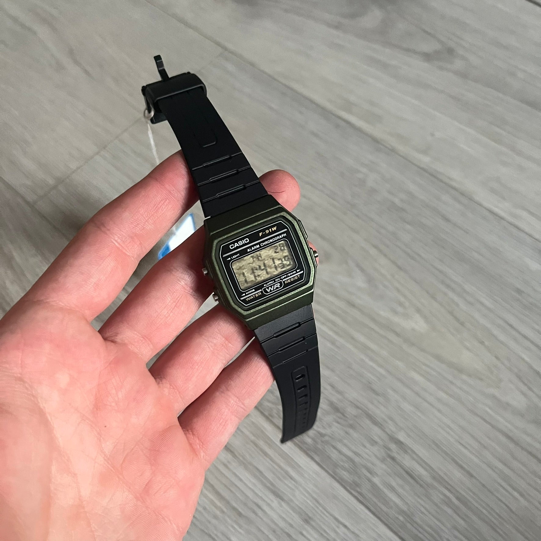 Custom Casio F-91W Military Green digital watch featuring a Camo filter screen. Slim 8.5 mm profile, lightweight 21 g build and flexible bio-based resin band ensure lasting comfort. Includes alarm, stopwatch, and microlight function for everyday functionality.