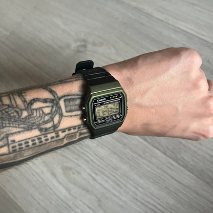 Custom Casio F-91W Military Green digital watch featuring a Camo filter screen. Slim 8.5 mm profile, lightweight 21 g build and flexible bio-based resin band ensure lasting comfort. Includes alarm, stopwatch, and microlight function for everyday functionality.