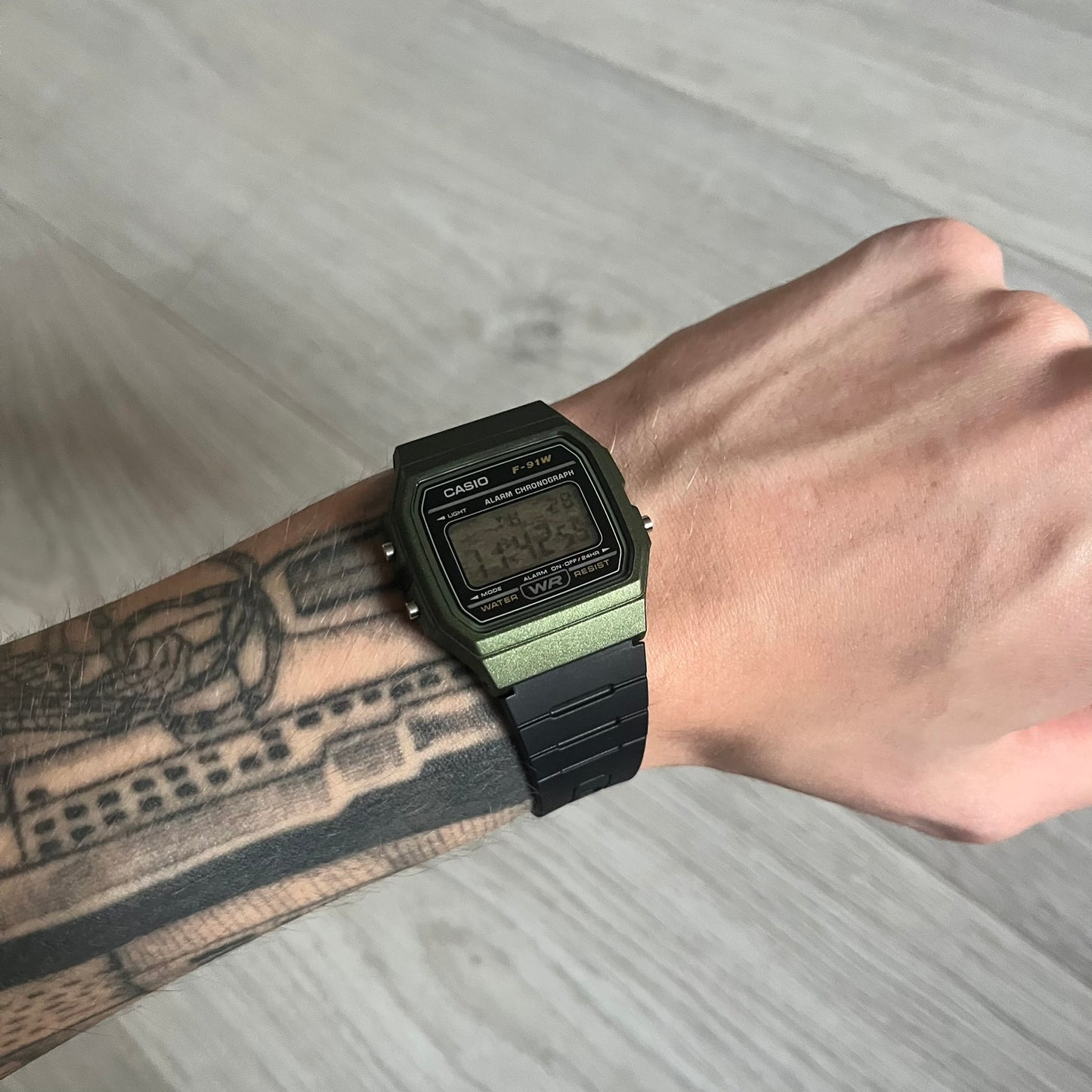Custom Casio F-91W Military Green digital watch featuring a Camo filter screen. Slim 8.5 mm profile, lightweight 21 g build and flexible bio-based resin band ensure lasting comfort. Includes alarm, stopwatch, and microlight function for everyday functionality.
