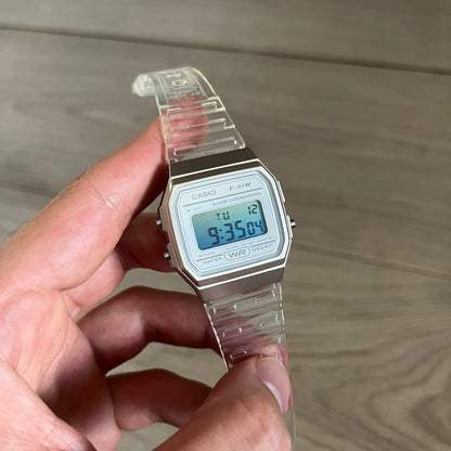 Custom Casio F-91W Clear/Transparent digital watch featuring a Gradient Blue filter screen. Slim 8.5 mm profile, lightweight 21 g build and flexible bio-based resin band ensure lasting comfort. Includes alarm, stopwatch, and microlight function for everyday functionality.