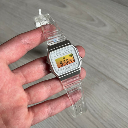 Custom Casio F-91W Clear/Transparent digital watch featuring a Yellow gradient. Slim 8.5 mm profile, lightweight 21 g build and flexible bio-based resin band ensure lasting comfort. Includes alarm, stopwatch, and microlight function for everyday functionality.