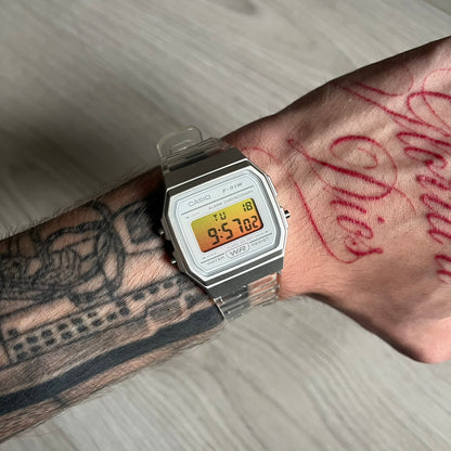 Custom Casio F-91W Clear/Transparent digital watch featuring a Yellow gradient. Slim 8.5 mm profile, lightweight 21 g build and flexible bio-based resin band ensure lasting comfort. Includes alarm, stopwatch, and microlight function for everyday functionality.