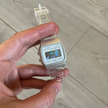 Custom Casio F-91W Clear/Transparent digital watch featuring a Holographic diamonds filter screen. Slim 8.5 mm profile, lightweight 21 g build and flexible bio-based resin band ensure lasting comfort. Includes alarm, stopwatch, and microlight function for everyday functionality.