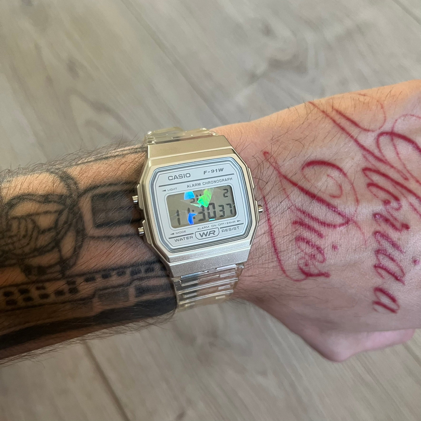 Custom Casio F-91W Clear/Transparent digital watch featuring a Holographic diamonds filter screen. Slim 8.5 mm profile, lightweight 21 g build and flexible bio-based resin band ensure lasting comfort. Includes alarm, stopwatch, and microlight function for everyday functionality.