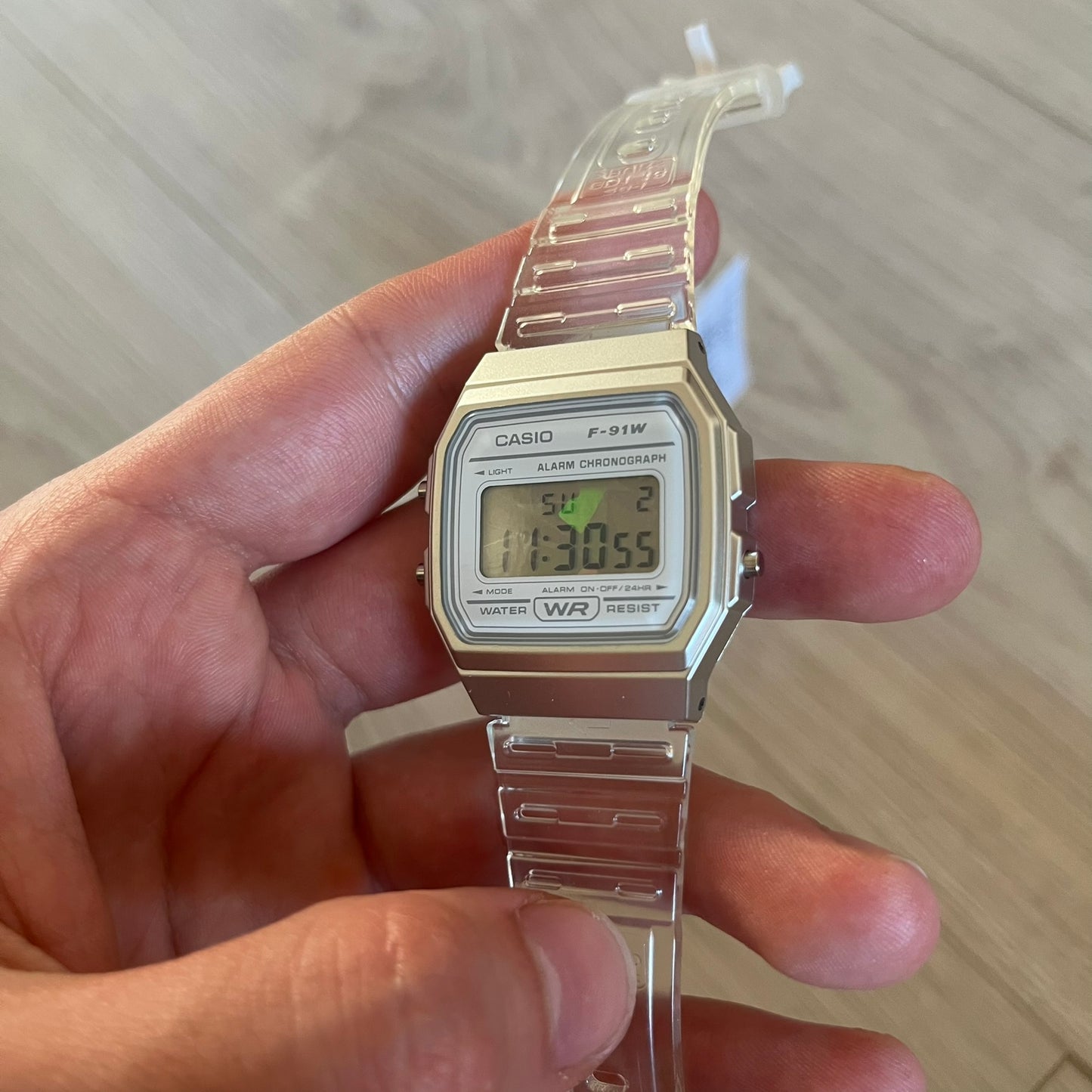 Custom Casio F-91W Clear/Transparent digital watch featuring a Holographic diamonds filter screen. Slim 8.5 mm profile, lightweight 21 g build and flexible bio-based resin band ensure lasting comfort. Includes alarm, stopwatch, and microlight function for everyday functionality.