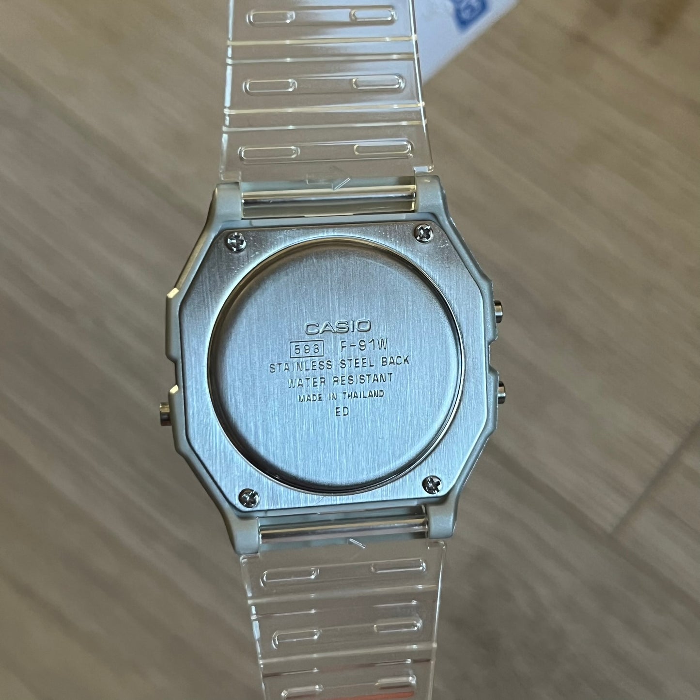 Custom Casio F-91W Clear/Transparent digital watch featuring a Holographic diamonds filter screen. Slim 8.5 mm profile, lightweight 21 g build and flexible bio-based resin band ensure lasting comfort. Includes alarm, stopwatch, and microlight function for everyday functionality.