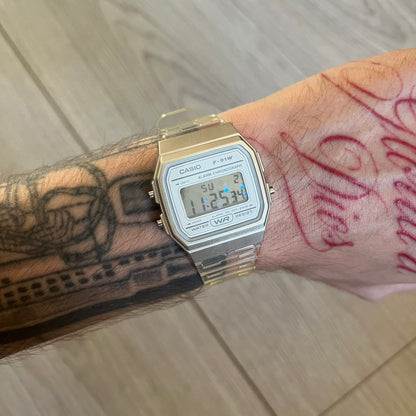 Custom Casio F-91W Clear/Transparent digital watch featuring a Holographic stars filter screen. Slim 8.5 mm profile, lightweight 21 g build and flexible bio-based resin band ensure lasting comfort. Includes alarm, stopwatch, and microlight function for everyday functionality.