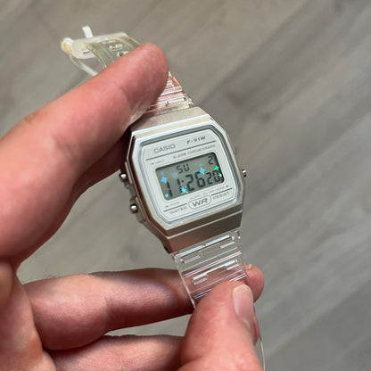 Custom Casio F-91W Clear/Transparent digital watch featuring a Holographic stars filter screen. Slim 8.5 mm profile, lightweight 21 g build and flexible bio-based resin band ensure lasting comfort. Includes alarm, stopwatch, and microlight function for everyday functionality.