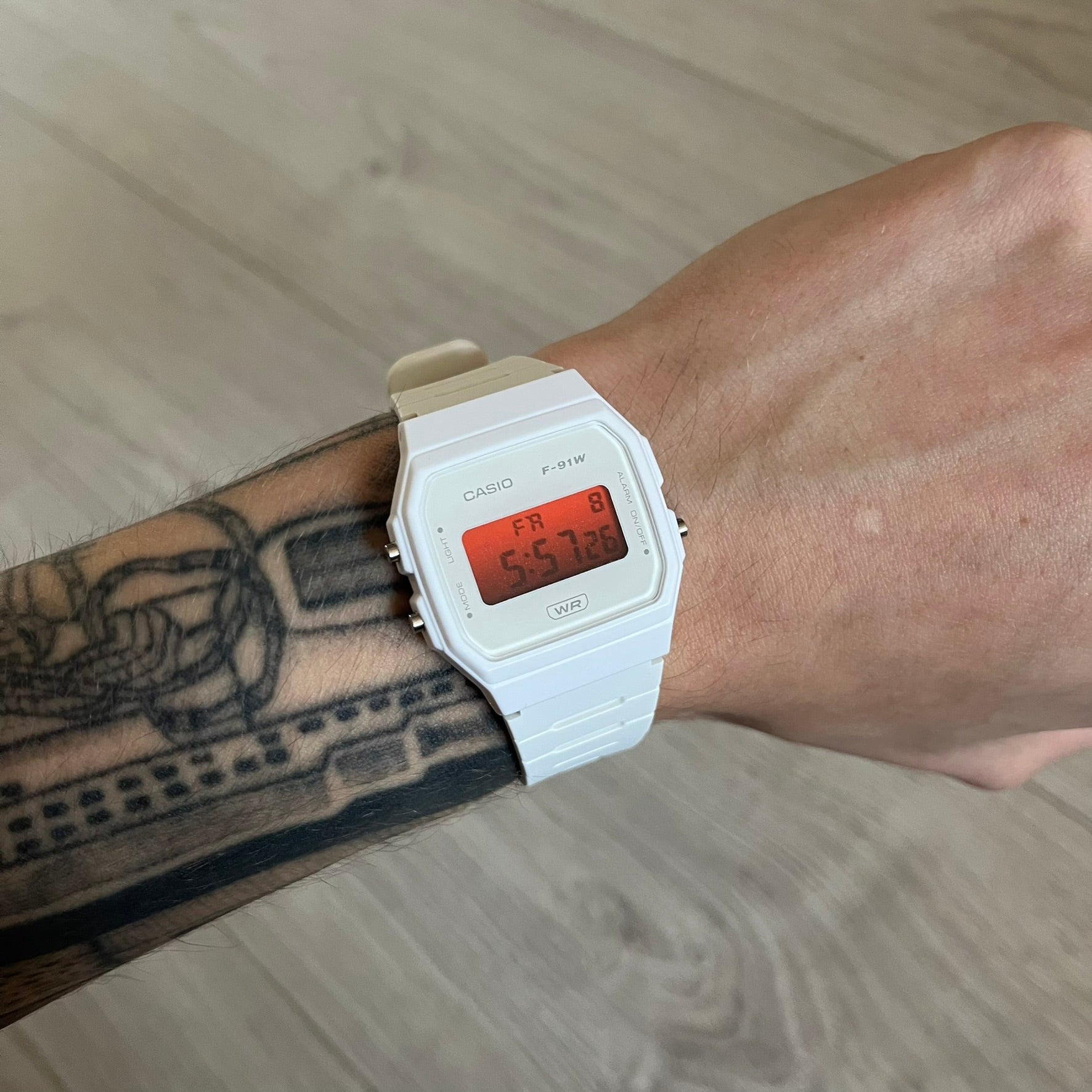 Custom Casio F-91W White digital watch featuring a Gradient Red filter screen. Slim 8.5 mm profile, lightweight 21 g build and flexible bio-based resin band ensure lasting comfort. Includes alarm, stopwatch, and microlight function for everyday functionality.