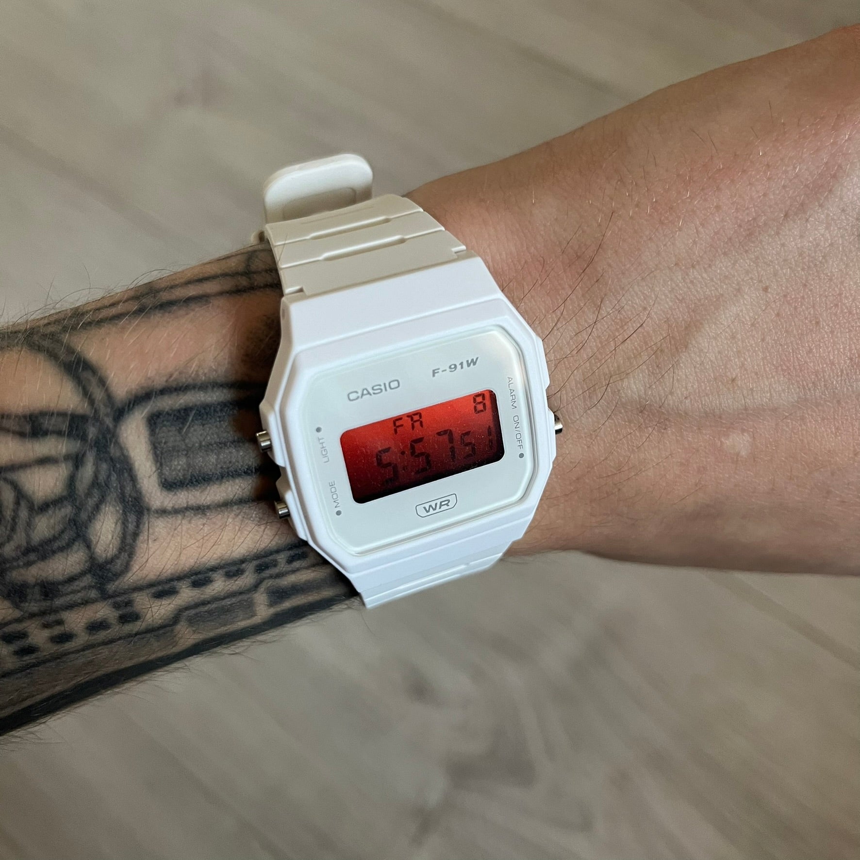 Custom Casio F-91W White digital watch featuring a Gradient Red filter screen. Slim 8.5 mm profile, lightweight 21 g build and flexible bio-based resin band ensure lasting comfort. Includes alarm, stopwatch, and microlight function for everyday functionality.