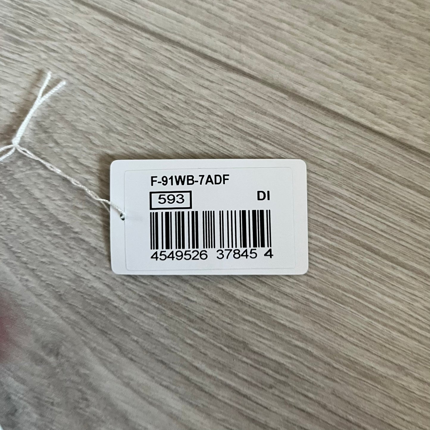 Custom Casio F-91W White digital watch featuring a Gradient Red filter screen. Slim 8.5 mm profile, lightweight 21 g build and flexible bio-based resin band ensure lasting comfort. Includes alarm, stopwatch, and microlight function for everyday functionality.