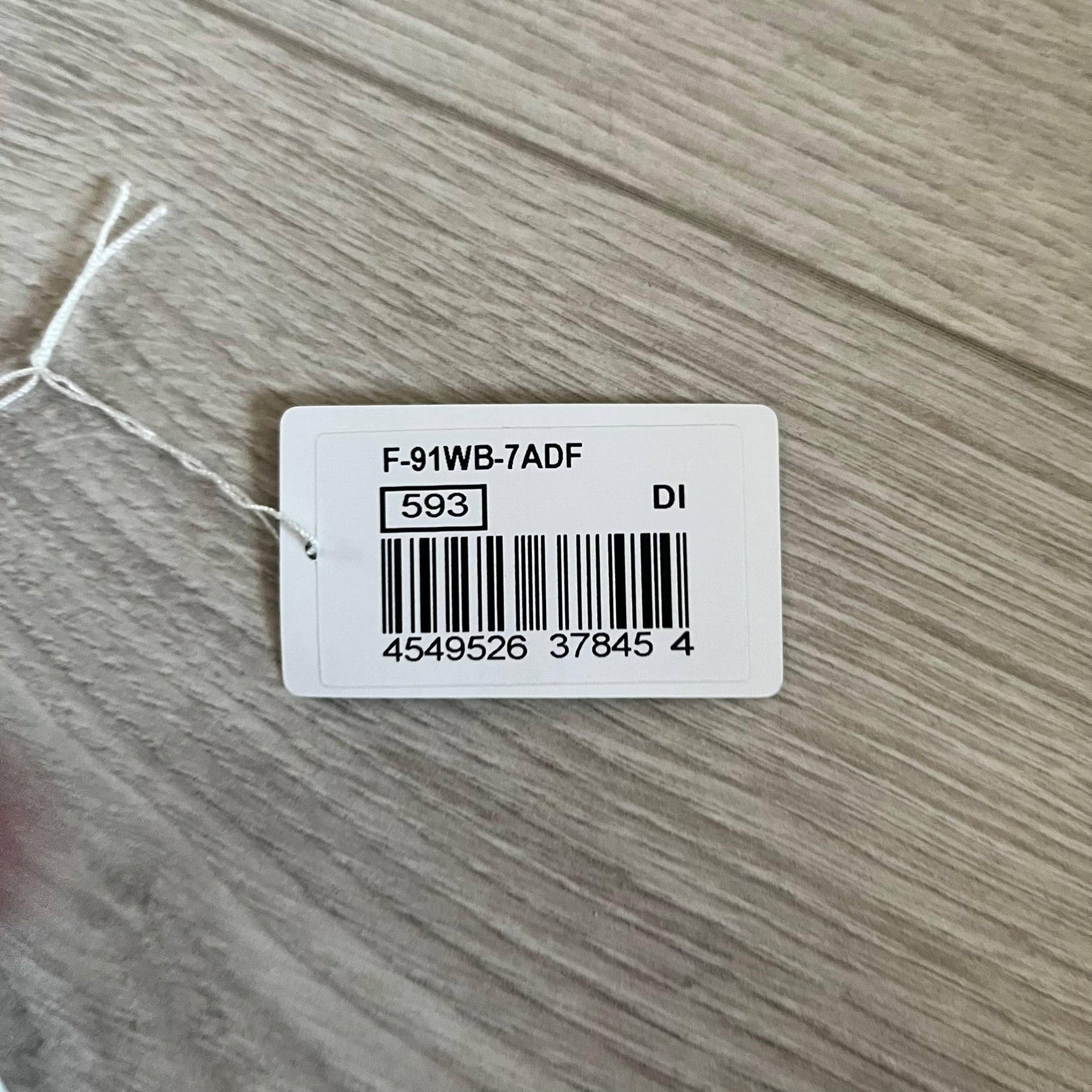 Custom Casio F-91W White digital watch featuring a Gradient Red filter screen. Slim 8.5 mm profile, lightweight 21 g build and flexible bio-based resin band ensure lasting comfort. Includes alarm, stopwatch, and microlight function for everyday functionality.