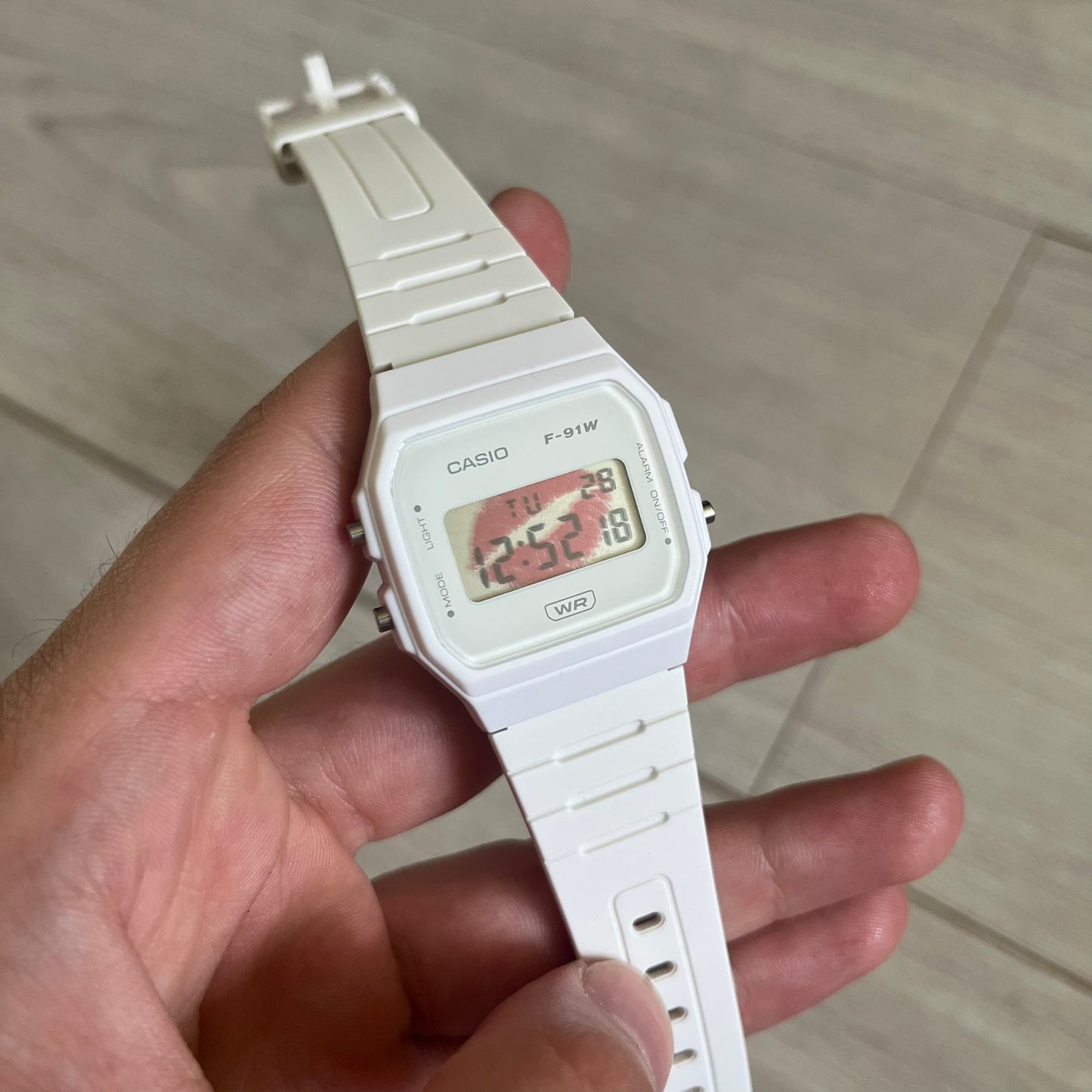 Custom Casio F-91W White digital watch featuring a Red Lips filter screen. Slim 8.5 mm profile, lightweight 21 g build and flexible bio-based resin band ensure lasting comfort. Includes alarm, stopwatch, and microlight function for everyday functionality.