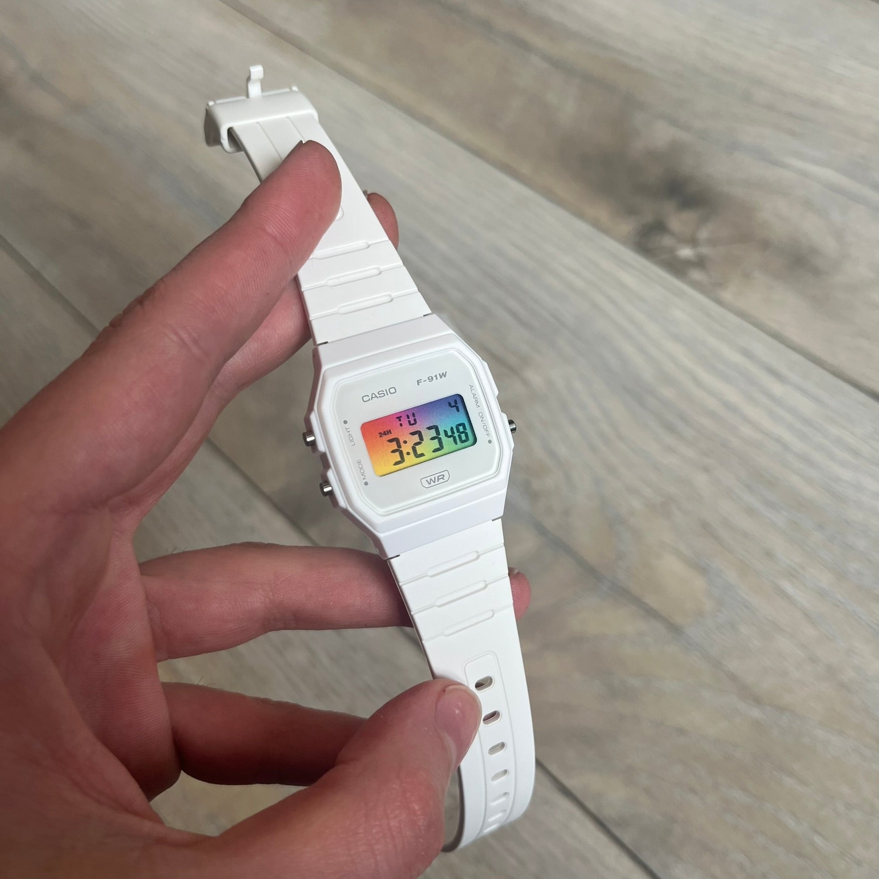 Custom Casio F-91W White digital watch featuring a Gradient multicolor filter screen. Slim 8.5 mm profile, lightweight 21 g build and flexible bio-based resin band ensure lasting comfort. Includes alarm, stopwatch, and microlight function for everyday functionality