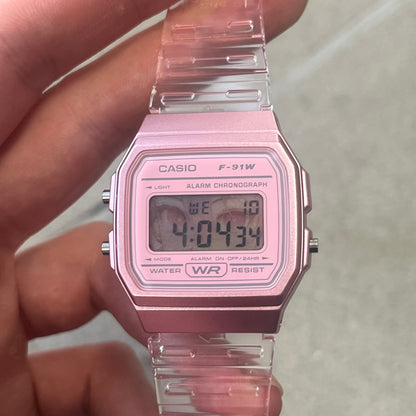 Custom Casio F-91W Pink digital watch featuring a Anime Eyes filter screen. Slim 8.5 mm profile, lightweight 21 g build and flexible bio-based resin band ensure lasting comfort. Includes alarm, stopwatch, and microlight function for everyday functionality.