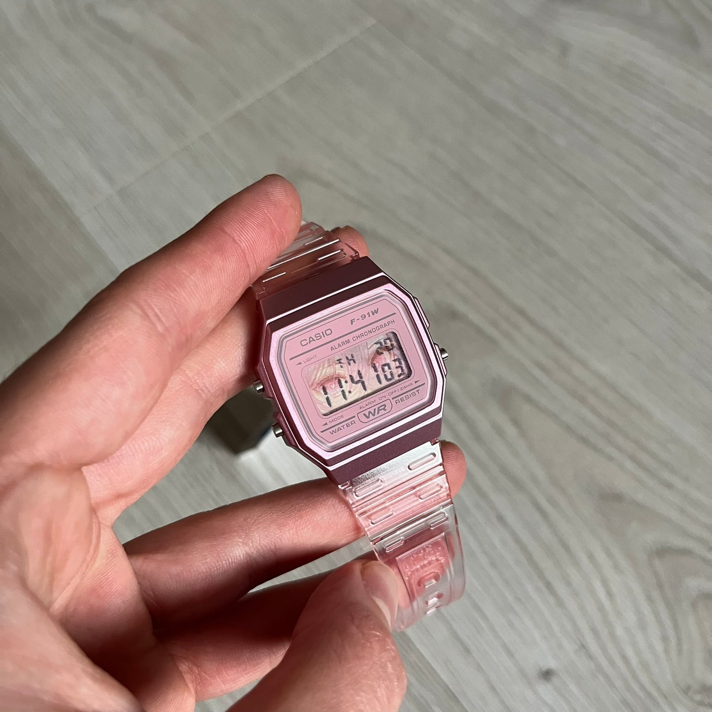 Custom Casio F-91W Pink digital watch featuring a Anime Eyes filter screen. Slim 8.5 mm profile, lightweight 21 g build and flexible bio-based resin band ensure lasting comfort. Includes alarm, stopwatch, and microlight function for everyday functionality.