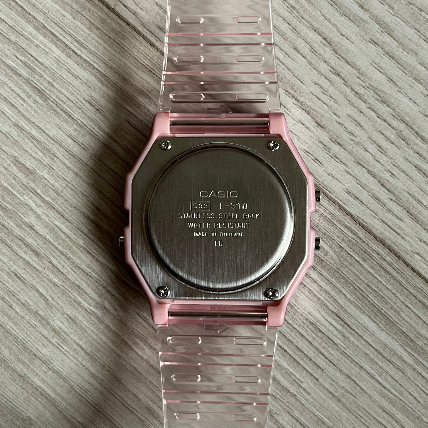 Custom Casio F-91W Pink digital watch featuring a Anime Eyes filter screen. Slim 8.5 mm profile, lightweight 21 g build and flexible bio-based resin band ensure lasting comfort. Includes alarm, stopwatch, and microlight function for everyday functionality.