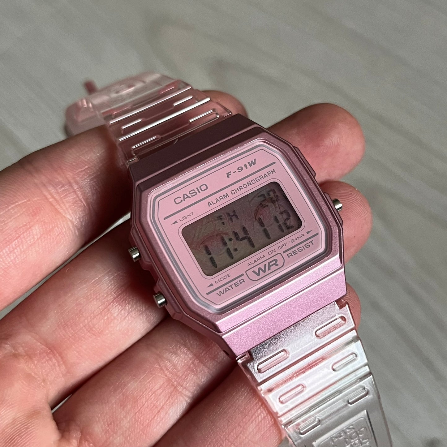Custom Casio F-91W Pink digital watch featuring a Anime Eyes filter screen. Slim 8.5 mm profile, lightweight 21 g build and flexible bio-based resin band ensure lasting comfort. Includes alarm, stopwatch, and microlight function for everyday functionality.