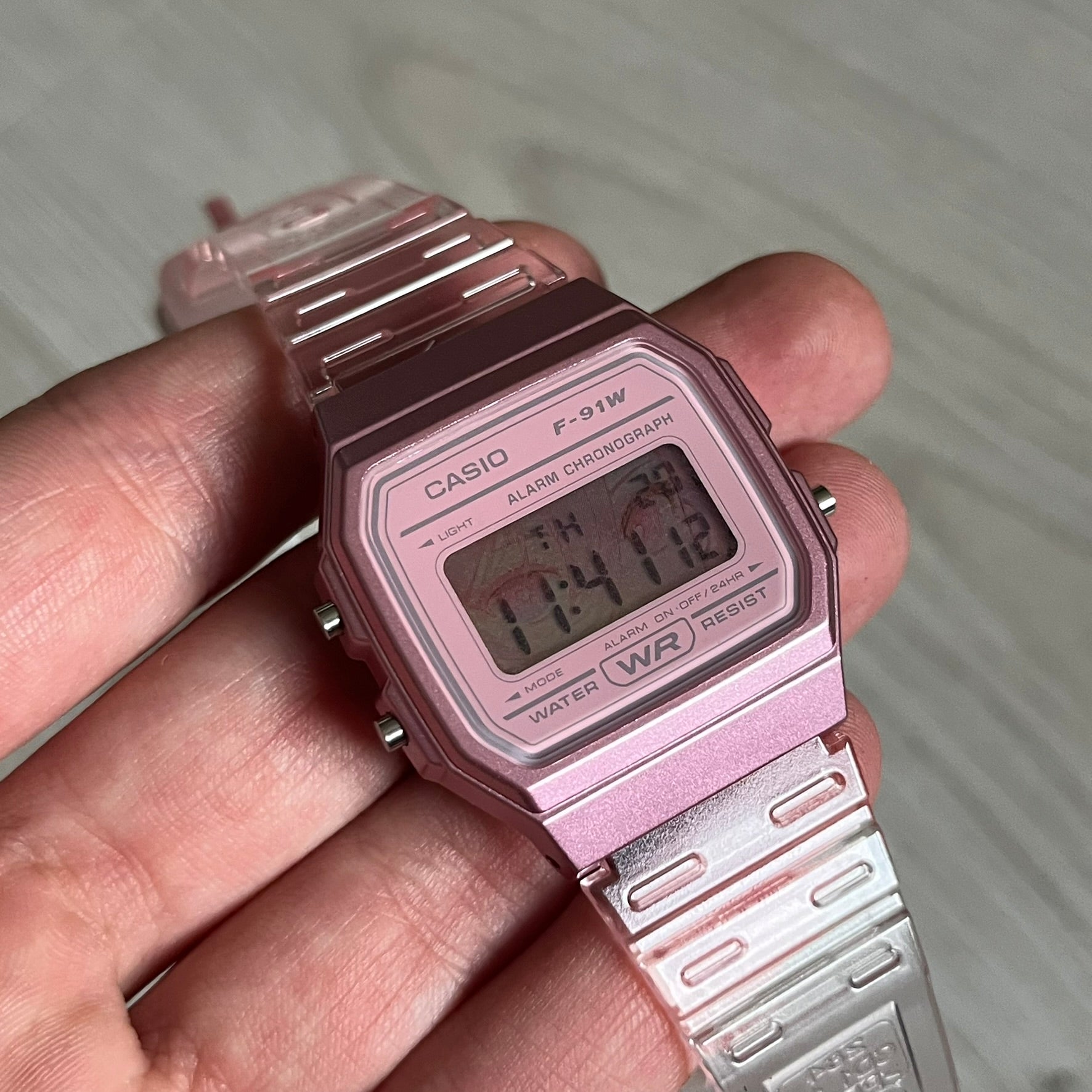 Custom Casio F-91W Pink digital watch featuring a Anime Eyes filter screen. Slim 8.5 mm profile, lightweight 21 g build and flexible bio-based resin band ensure lasting comfort. Includes alarm, stopwatch, and microlight function for everyday functionality.