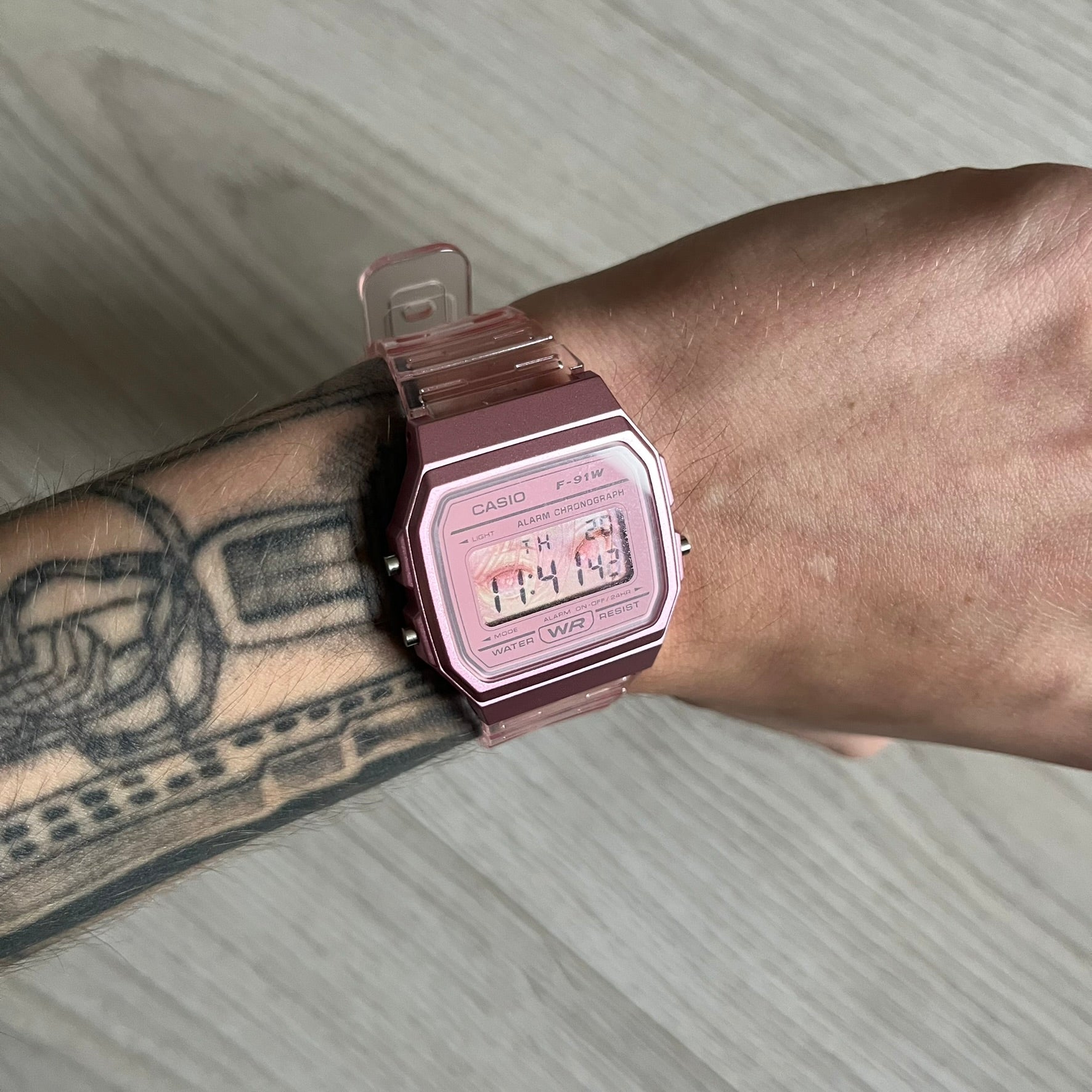 Custom Casio F-91W Pink digital watch featuring a Anime Eyes filter screen. Slim 8.5 mm profile, lightweight 21 g build and flexible bio-based resin band ensure lasting comfort. Includes alarm, stopwatch, and microlight function for everyday functionality.