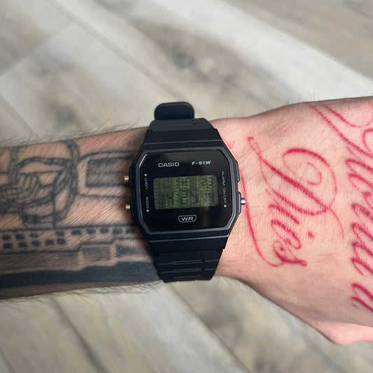 Custom Casio F-91W Black digital watch featuring a Matrix green numbers filter screen. Slim 8.5 mm profile, lightweight 21 g build and flexible bio-based resin band ensure lasting comfort. Includes alarm, stopwatch, and microlight function for everyday functionality.