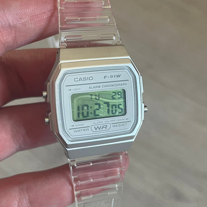 Custom Casio F-91W Clear/Transparent digital watch featuring a Money graphic filter screen. Slim 8.5 mm profile, lightweight 21 g build and flexible bio-based resin band ensure lasting comfort. Includes alarm, stopwatch, and microlight function for everyday functionality.