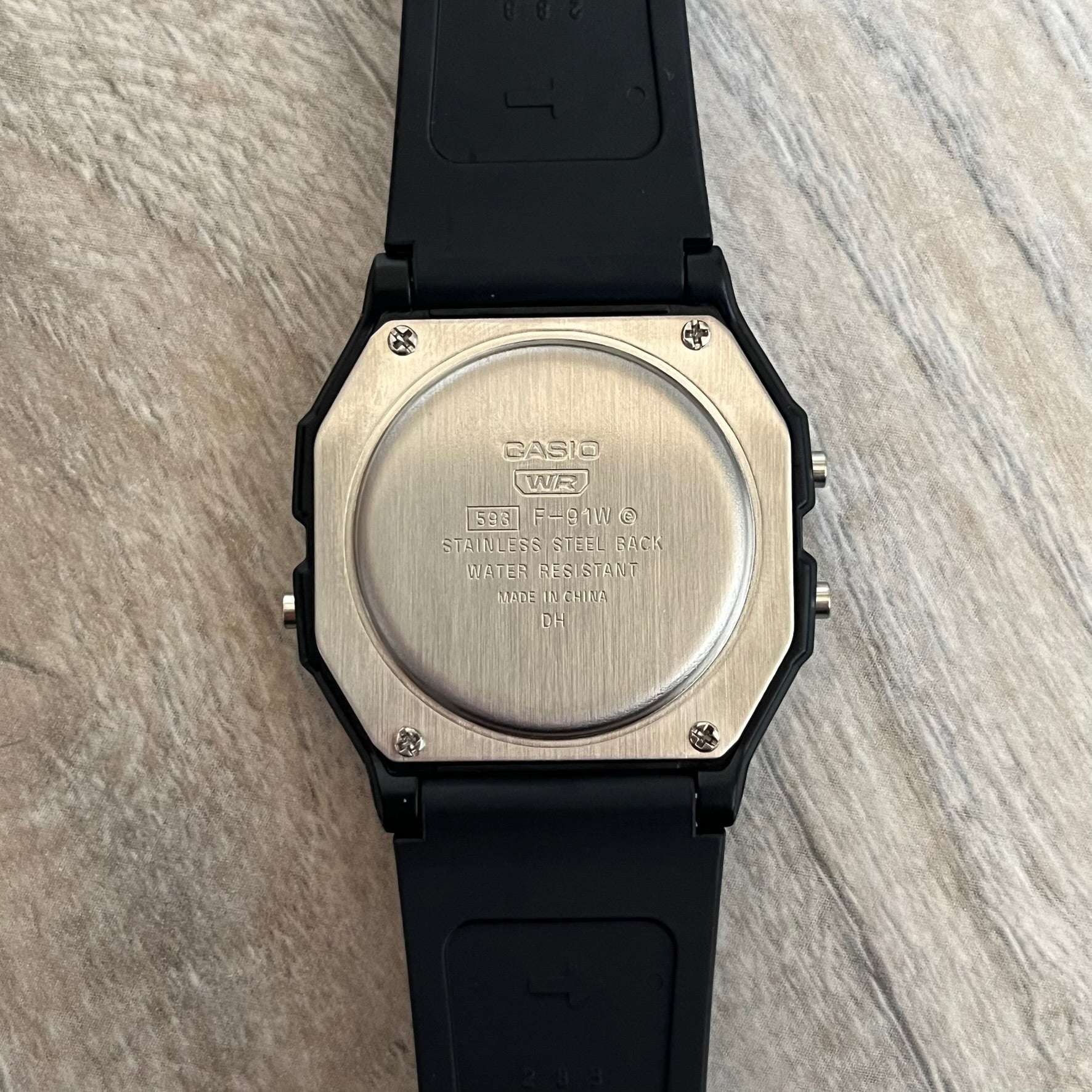 Custom Casio F-91W Black digital watch featuring a Gradient Yellow &amp; Orange filter screen. Slim 8.5 mm profile, lightweight 21 g build and flexible bio-based resin band ensure lasting comfort. Includes alarm, stopwatch, and microlight function for everyday functionality.