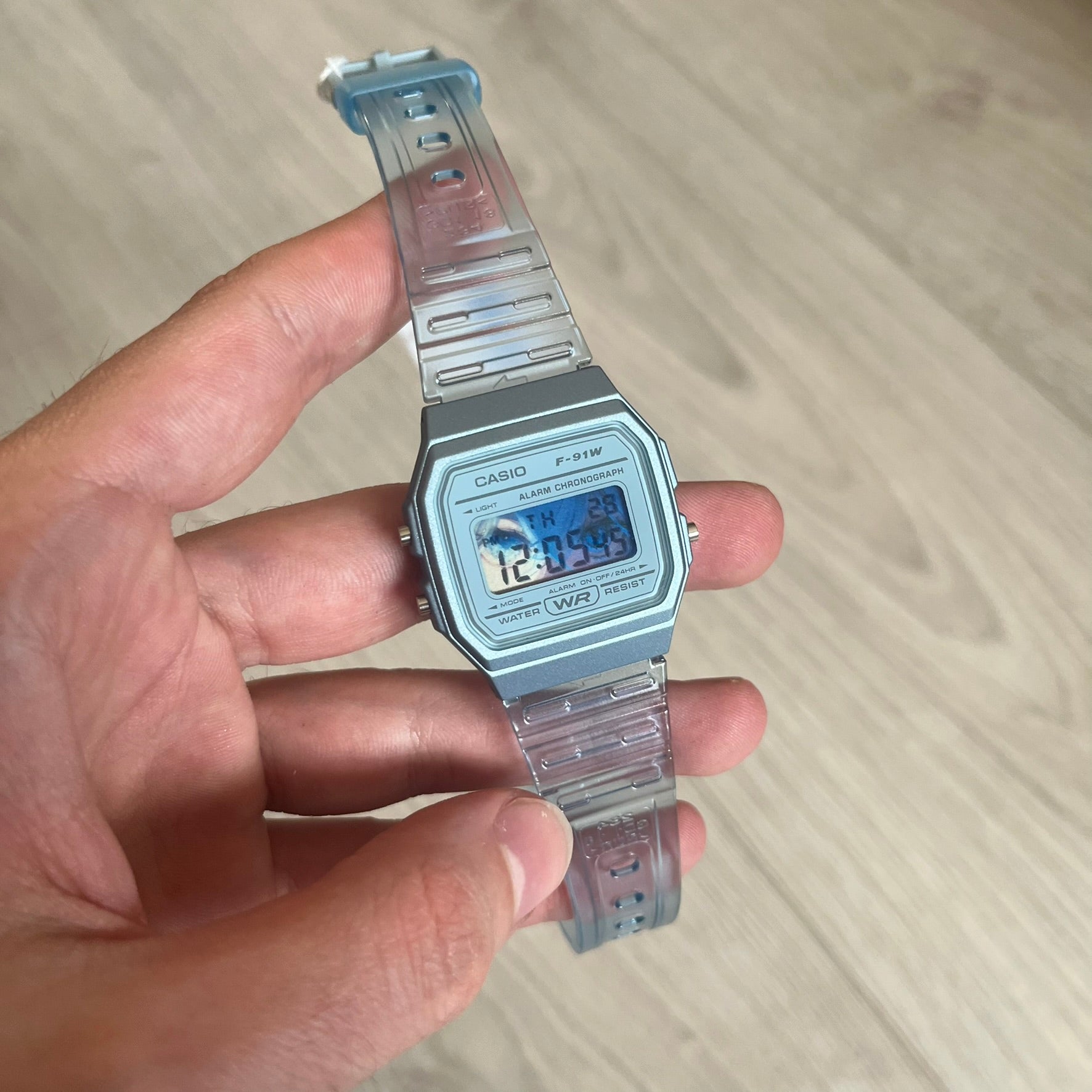 Custom Casio F-91W Blue digital watch featuring a Blue Anime eyes filter screen. Slim 8.5 mm profile, lightweight 21 g build and flexible bio-based resin band ensure lasting comfort. Includes alarm, stopwatch, and microlight function for everyday functionality.