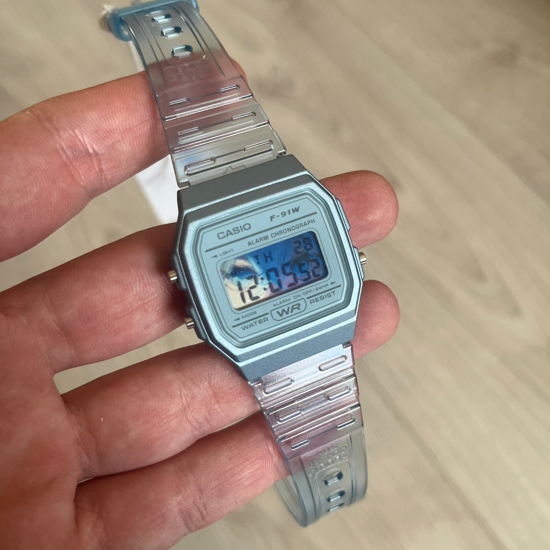 Custom Casio F-91W Blue digital watch featuring a Blue Anime eyes filter screen. Slim 8.5 mm profile, lightweight 21 g build and flexible bio-based resin band ensure lasting comfort. Includes alarm, stopwatch, and microlight function for everyday functionality.
