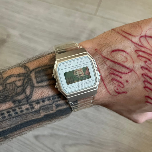 Custom Casio F-91W Clear/Transparent digital watch featuring a Poker table graphic filter screen. Slim 8.5 mm profile, lightweight 21 g build and flexible bio-based resin band ensure lasting comfort. Includes alarm, stopwatch, and microlight function for everyday functionality.
