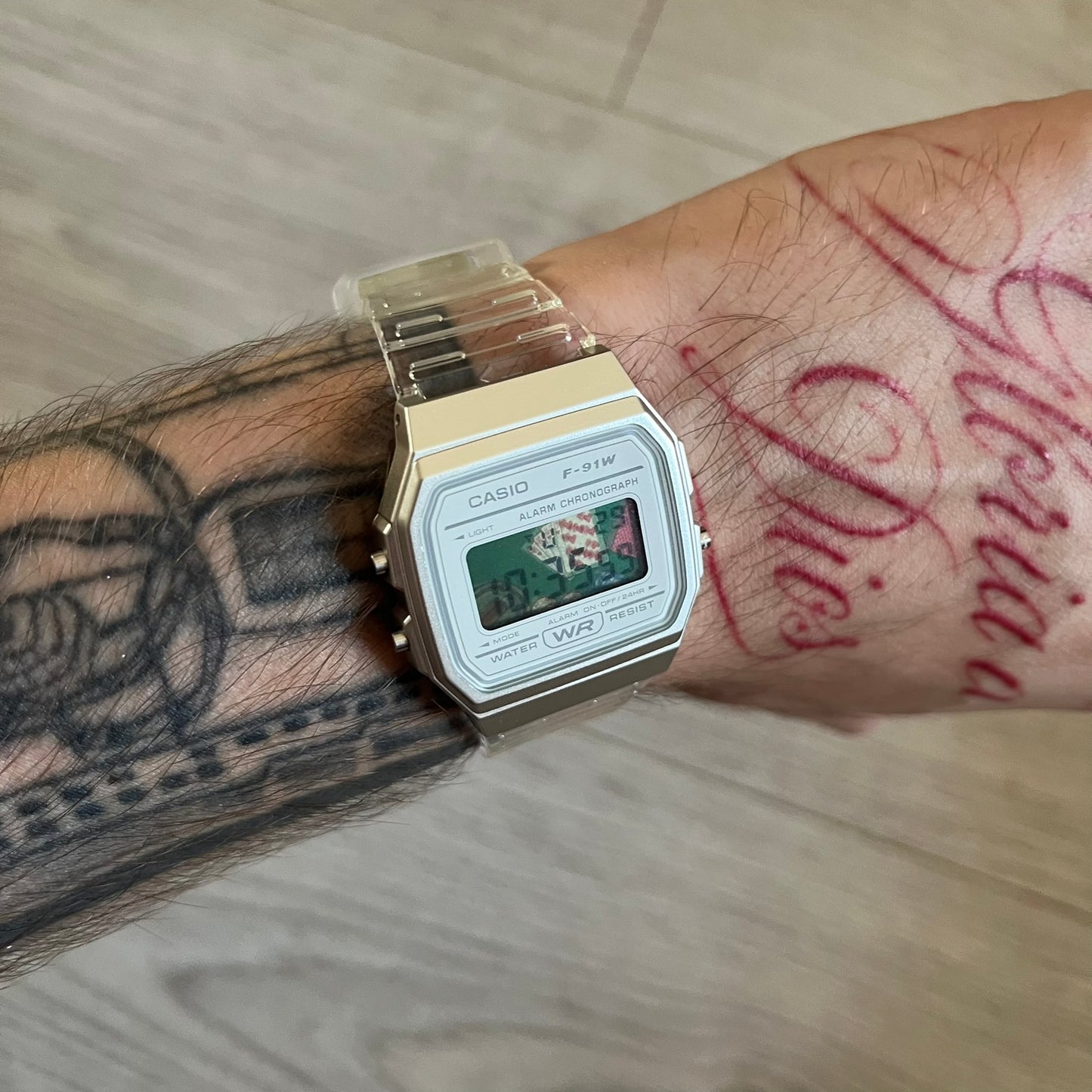 Custom Casio F-91W Clear/Transparent digital watch featuring a Poker table graphic filter screen. Slim 8.5 mm profile, lightweight 21 g build and flexible bio-based resin band ensure lasting comfort. Includes alarm, stopwatch, and microlight function for everyday functionality.