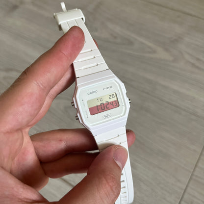 Custom Casio F-91W White digital watch featuring a Poland flag filter screen. Slim 8.5 mm profile, lightweight 21 g build and flexible bio-based resin band ensure lasting comfort. Includes alarm, stopwatch, and microlight function for everyday functionality.