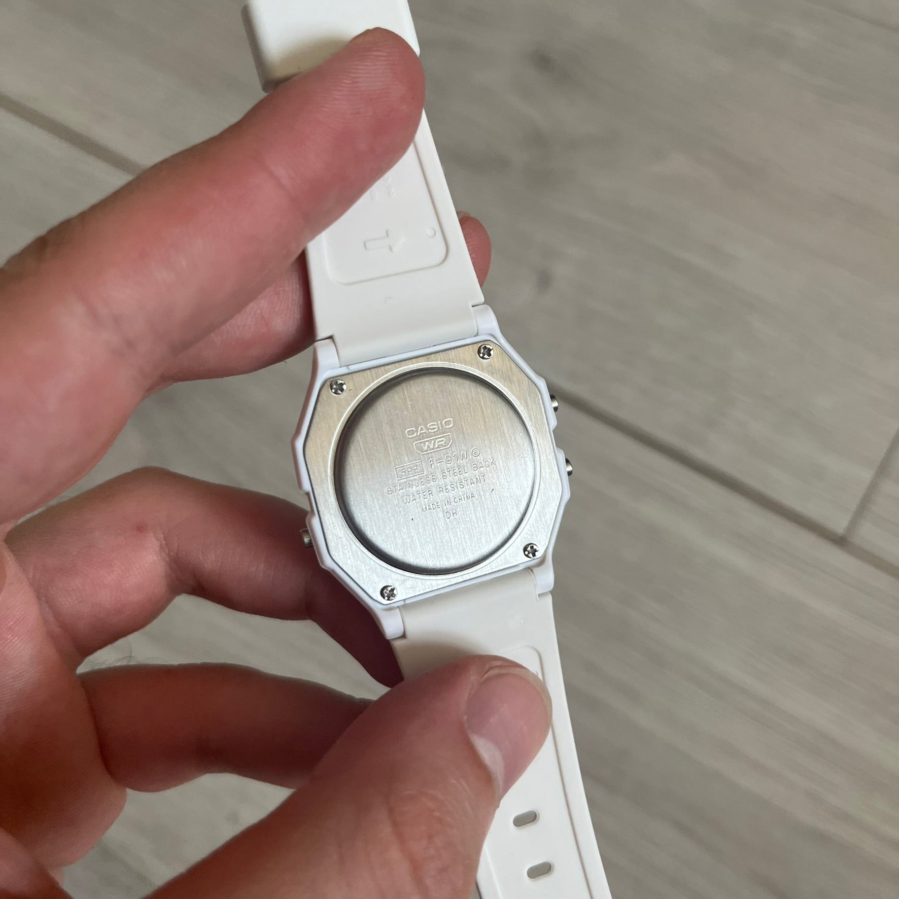 Custom Casio F-91W White digital watch featuring a Poland flag filter screen. Slim 8.5 mm profile, lightweight 21 g build and flexible bio-based resin band ensure lasting comfort. Includes alarm, stopwatch, and microlight function for everyday functionality.