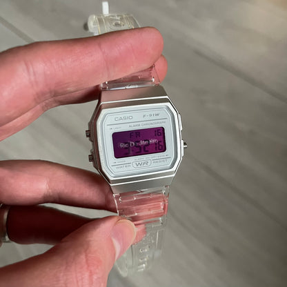 Custom Casio F-91W Clear/Transparent digital watch featuring a Rio De Janeiro filter screen. Slim 8.5 mm profile, lightweight 21 g build and flexible bio-based resin band ensure lasting comfort. Includes alarm, stopwatch, and microlight function for everyday functionality.