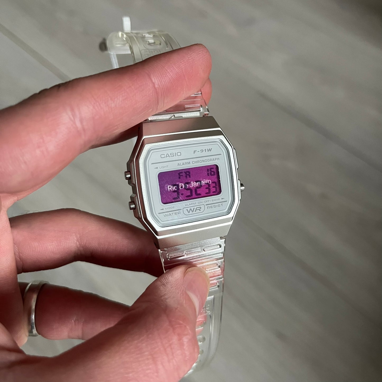 Custom Casio F-91W Clear/Transparent digital watch featuring a Rio De Janeiro filter screen. Slim 8.5 mm profile, lightweight 21 g build and flexible bio-based resin band ensure lasting comfort. Includes alarm, stopwatch, and microlight function for everyday functionality.