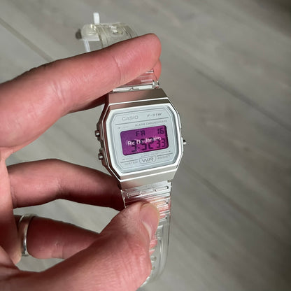 Custom Casio F-91W Clear/Transparent digital watch featuring a Rio De Janeiro filter screen. Slim 8.5 mm profile, lightweight 21 g build and flexible bio-based resin band ensure lasting comfort. Includes alarm, stopwatch, and microlight function for everyday functionality.