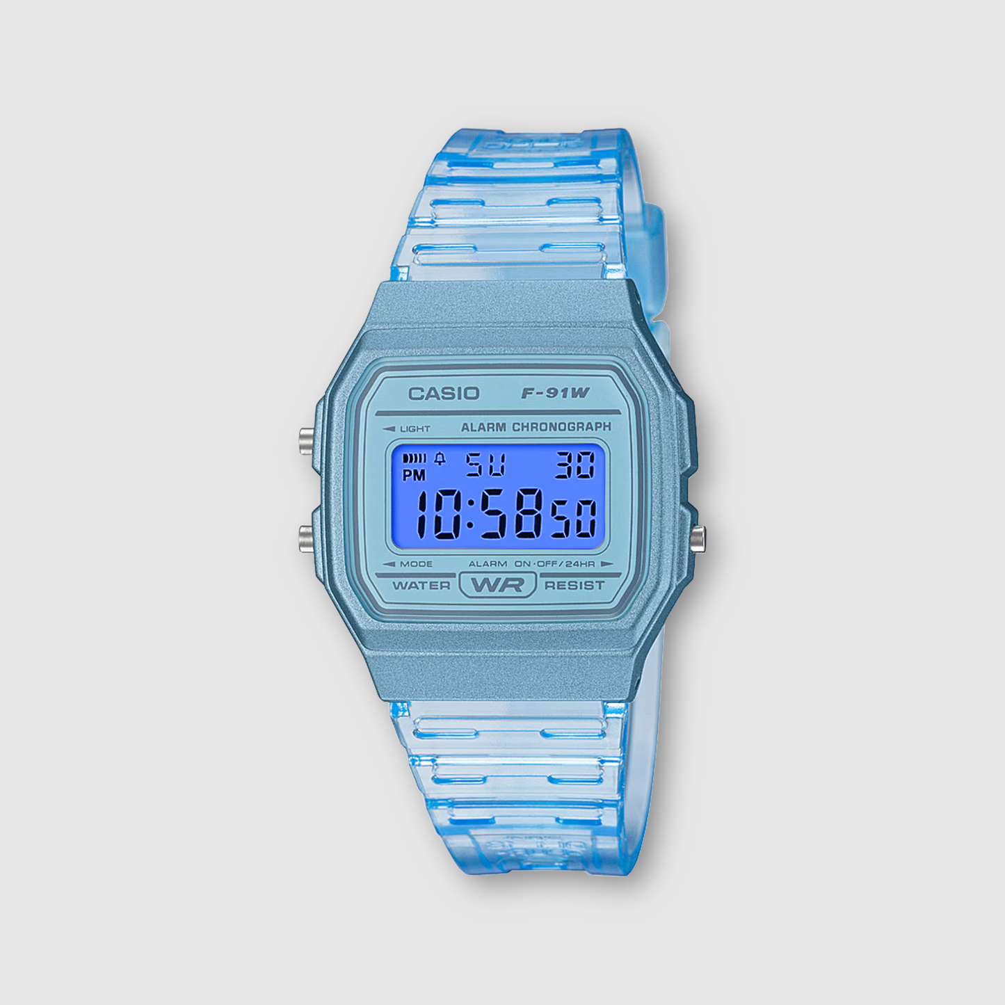 Blue Casio digital watch with a clear strap on a light gray background