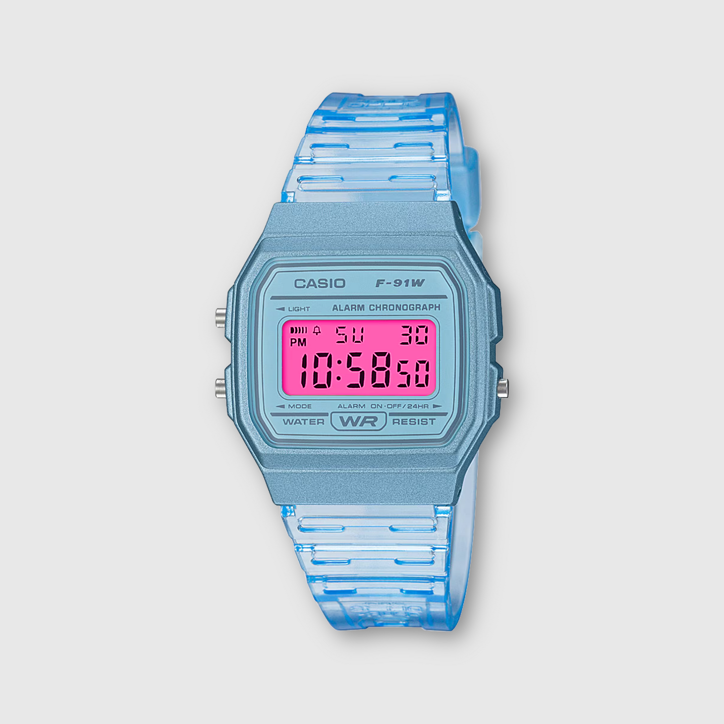 Casio digital watch with blue strap and pink display on a light gray background