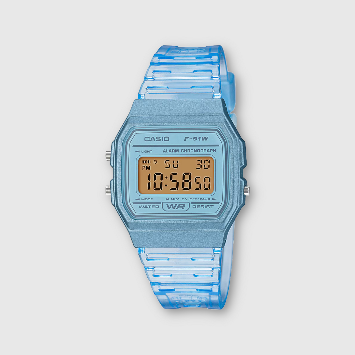 Blue Casio digital watch with a clear strap on a light gray background